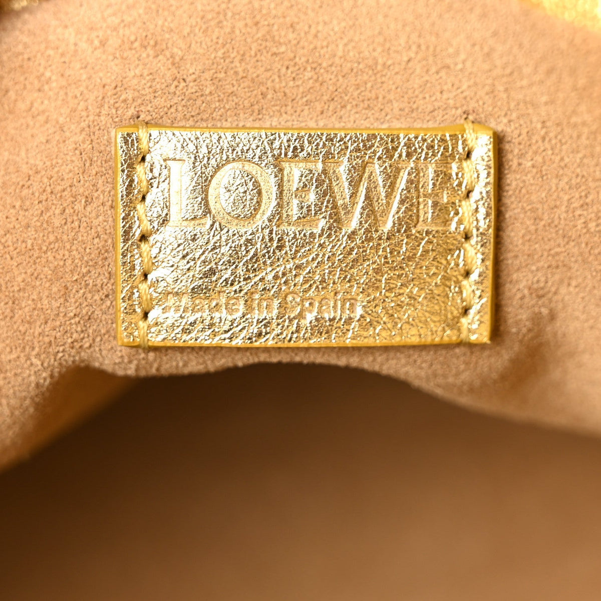 Metallic Laminated Lambskin Medium Scale Flamenco Knot Clutch Gold