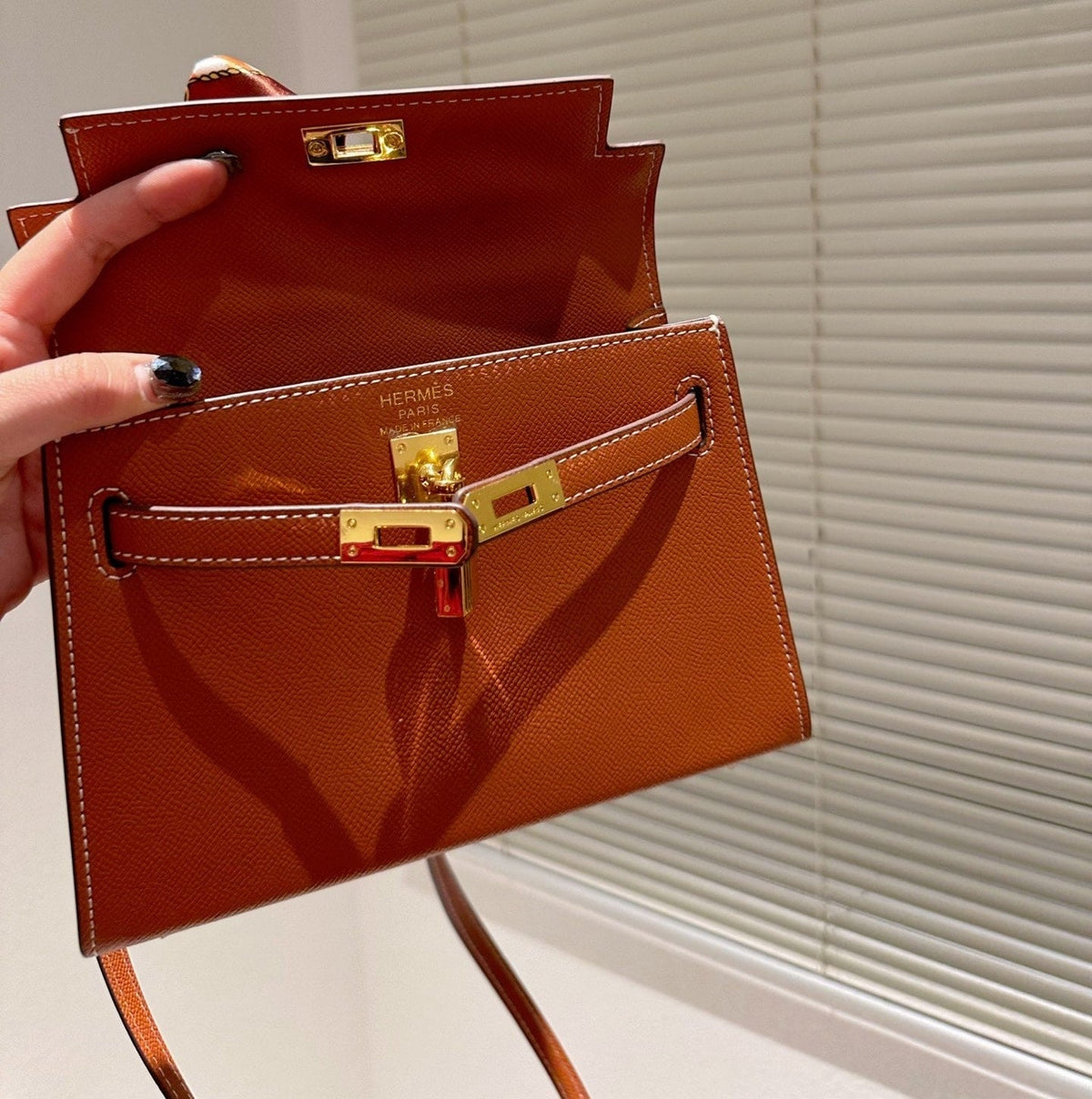 H KELLY TOGO ORANGE GOLD HARDWARE 20CM