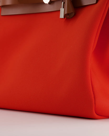 Hermès Herbag 39 in Orange Mecano Toile Canvas and Fauve Vache Hunter Leather with Palladium Hardware
