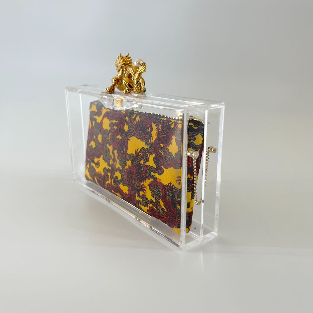 Charlotte Olympia clear plexi clutch with dragon lock